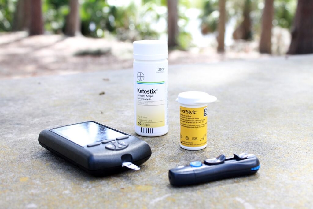 Advanced Lipid Panels: Particle Size and Density Testing Beyond Cholesterol black smartphone beside white plastic bottle and black smart