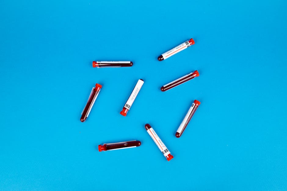 What Is a Pathology Test and When Do You Need One multiple blood sample tubes arranged on a vivid blue backgro